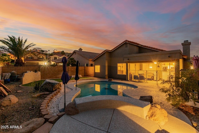 view of pool with a fenced in pool, a patio, and a fenced backyard