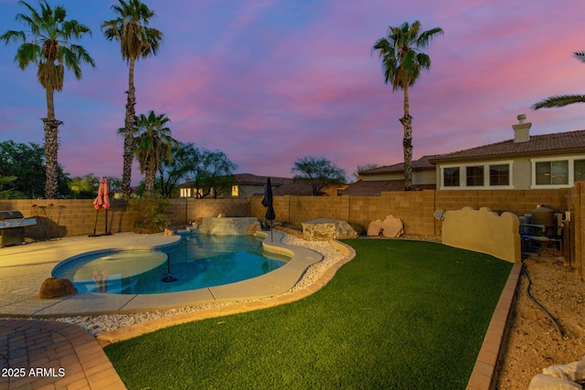 view of pool with a lawn, a patio, a fenced in pool, and a fenced backyard