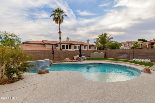 view of pool featuring a patio, a fenced in pool, and a fenced backyard