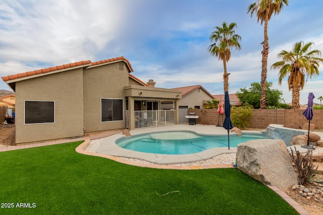 view of pool with a lawn, a patio, a fenced in pool, and a fenced backyard