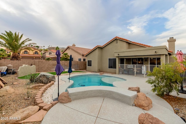 view of pool featuring a fenced in pool, a patio area, and a fenced backyard