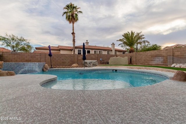 view of pool with a patio, a fenced in pool, and a fenced backyard