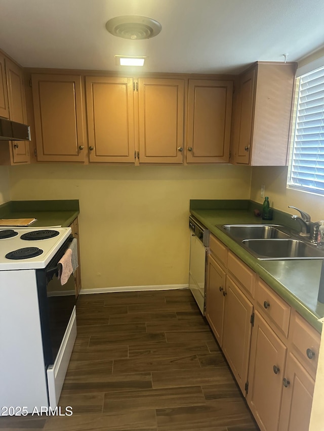 kitchen with sink, white appliances, and light brown cabinets