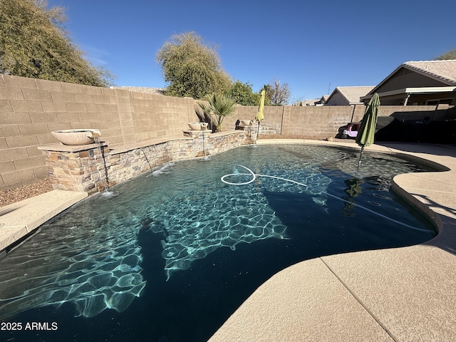 view of swimming pool with a fenced in pool and a fenced backyard