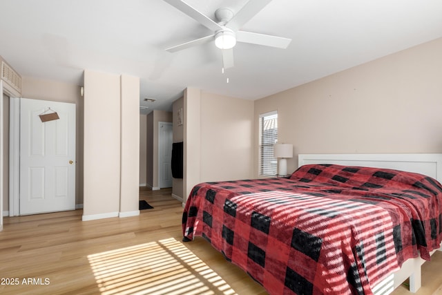 bedroom with ceiling fan and light wood-type flooring