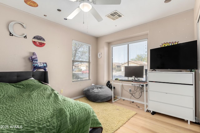 bedroom featuring ceiling fan and hardwood / wood-style flooring