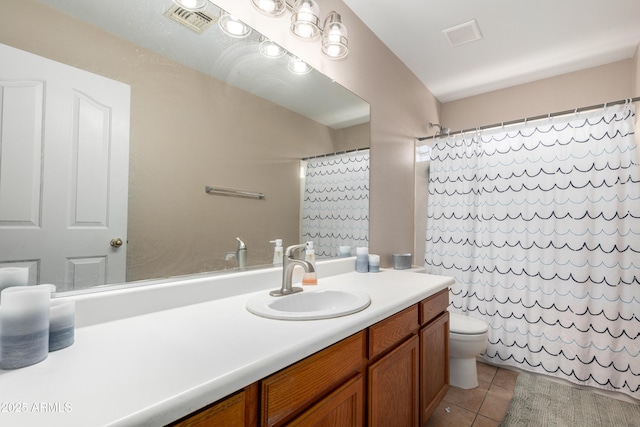 bathroom with tile patterned flooring, vanity, toilet, and walk in shower