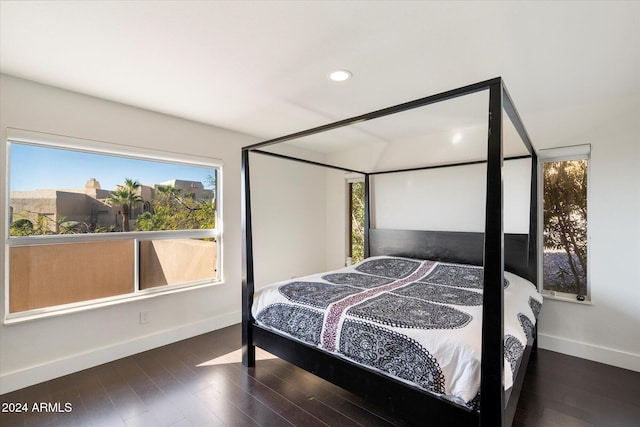 bedroom featuring dark hardwood / wood-style flooring