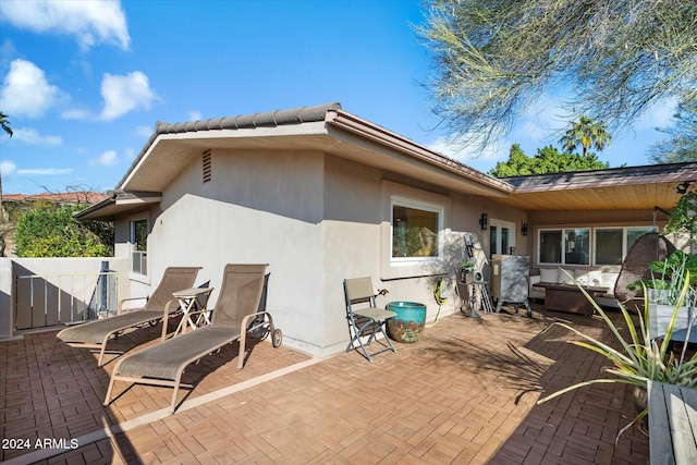 back of house with a patio area