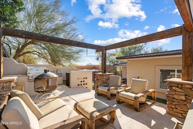 view of patio / terrace with an outdoor kitchen and grilling area