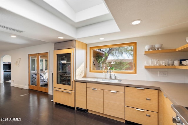 kitchen with light brown cabinetry, dark hardwood / wood-style floors, wine cooler, and sink