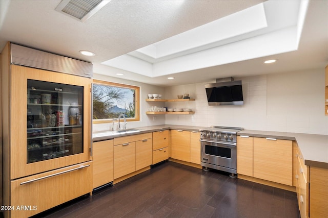 kitchen with sink, beverage cooler, dark hardwood / wood-style flooring, light brown cabinetry, and appliances with stainless steel finishes