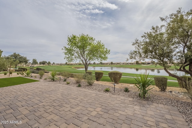 view of patio featuring a water view