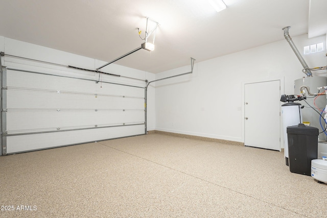 garage with a garage door opener and baseboards