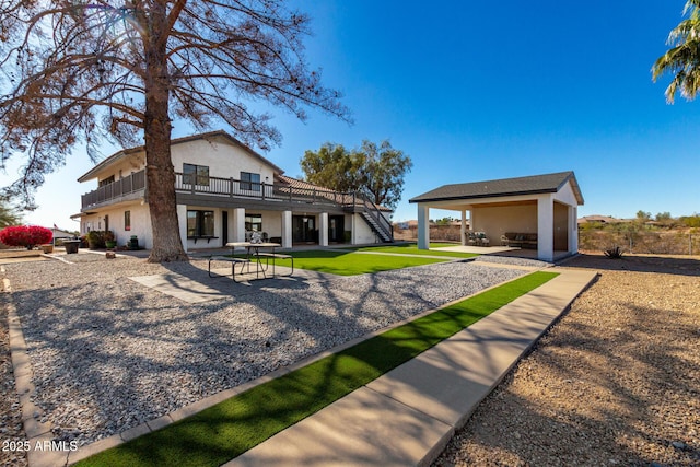 rear view of property featuring a patio area