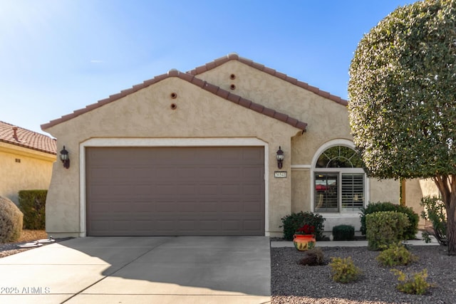 mediterranean / spanish house with a garage