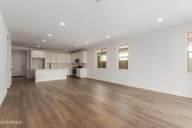 unfurnished living room featuring light hardwood / wood-style flooring