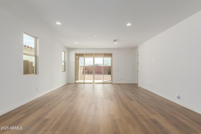 empty room featuring hardwood / wood-style flooring