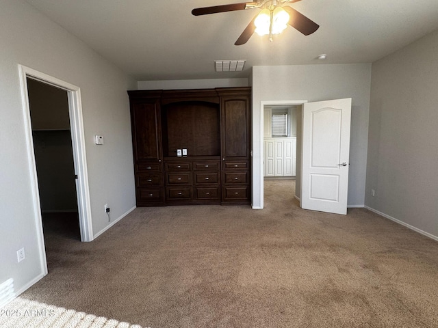 876 S Colonial Dr, Gilbert, AZ 85296 - unfurnished bedroom with carpet flooring, a walk in closet, and ceiling fan