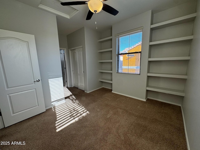 876 S Colonial Dr, Gilbert, AZ 85296 - unfurnished bedroom with dark colored carpet, a closet, and ceiling fan