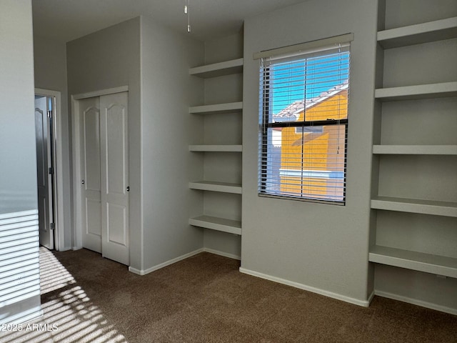 876 S Colonial Dr, Gilbert, AZ 85296 - unfurnished bedroom with dark carpet and a closet