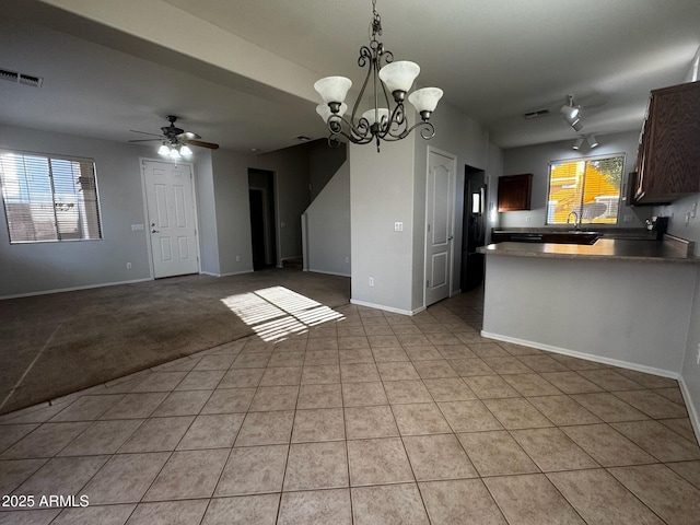 876 S Colonial Dr, Gilbert, AZ 85296 - kitchen with decorative light fixtures, ceiling fan, light tile patterned floors, a peninsula, and open floor plan