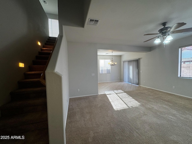 876 S Colonial Dr, Gilbert, AZ 85296 - unfurnished living room featuring a chandelier, stairway, plenty of natural light, and ceiling fan