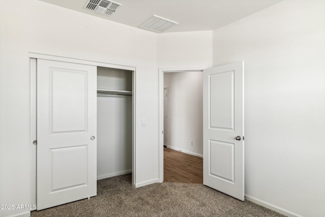 25478 W Graham Trl, Buckeye, AZ 85326 - unfurnished bedroom with carpet flooring, a closet, and baseboards