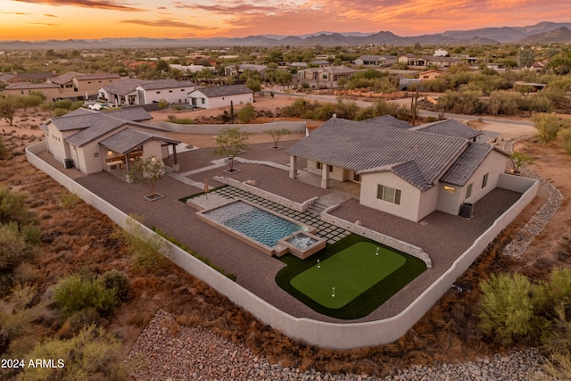 aerial view at dusk with a mountain view