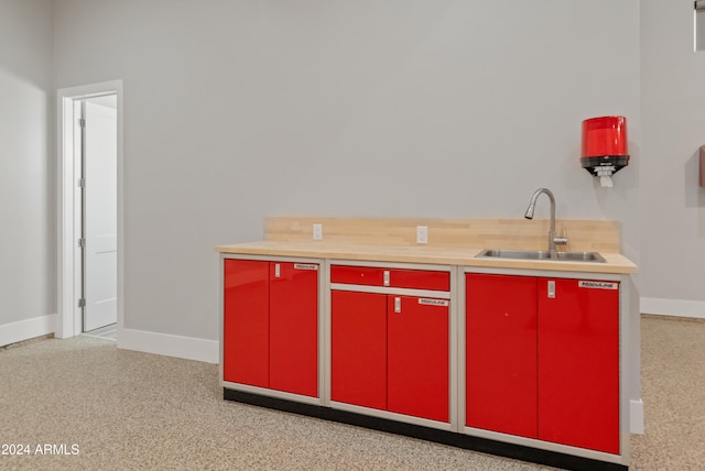 kitchen with wood counters and sink