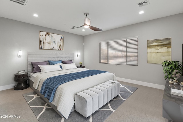 bedroom with light carpet and ceiling fan