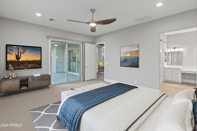 bedroom with light hardwood / wood-style floors, access to outside, connected bathroom, and ceiling fan