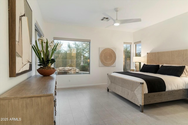 bedroom with light tile patterned flooring, visible vents, a ceiling fan, and baseboards