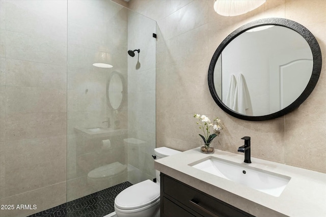 bathroom featuring tile walls, toilet, walk in shower, and tasteful backsplash