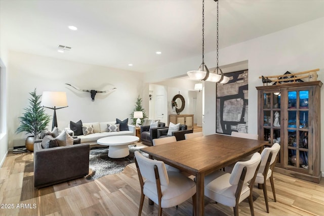 dining space featuring recessed lighting, visible vents, and light wood finished floors