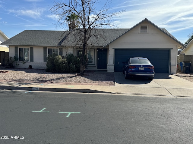 ranch-style house featuring a garage