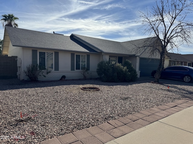 ranch-style house featuring a garage