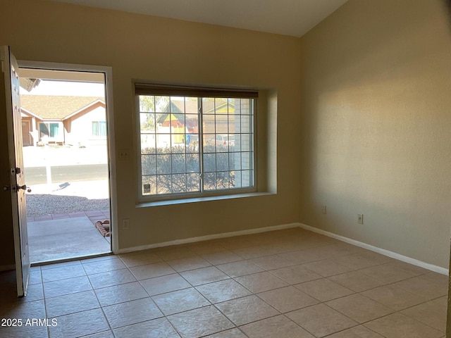 unfurnished room with light tile patterned floors