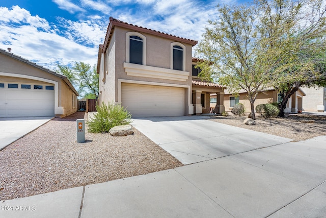 mediterranean / spanish-style house featuring a garage