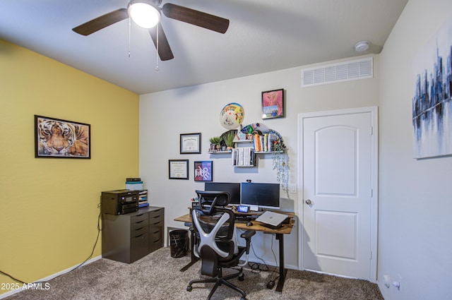 office area with carpet flooring, a ceiling fan, and visible vents