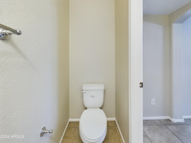 bathroom with tile patterned floors and toilet