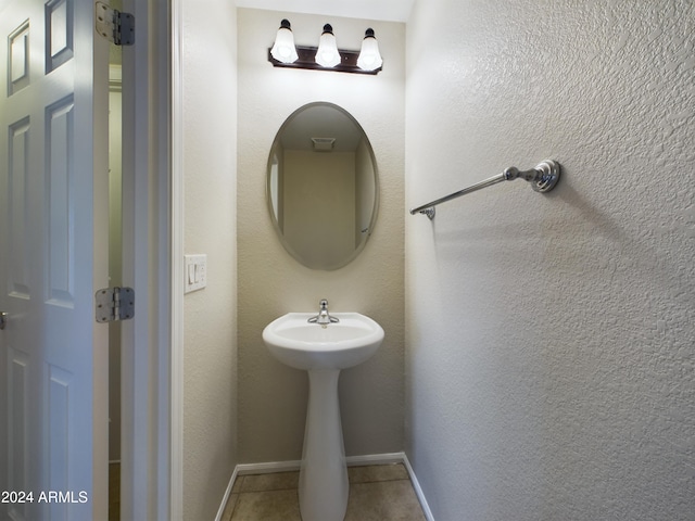 bathroom with tile patterned flooring