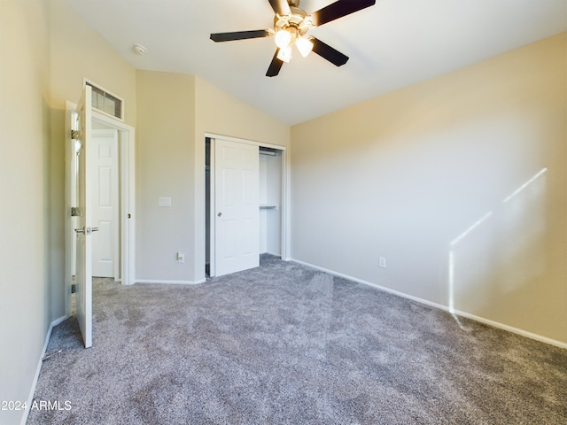 unfurnished bedroom with carpet flooring, ceiling fan, a closet, and vaulted ceiling