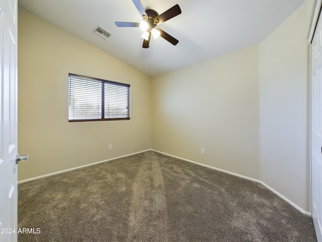 carpeted spare room with ceiling fan and lofted ceiling