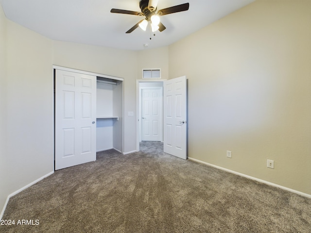 unfurnished bedroom with ceiling fan, carpet floors, and a closet