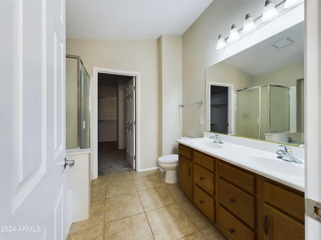 bathroom featuring tile patterned floors, vanity, a shower with door, and vaulted ceiling