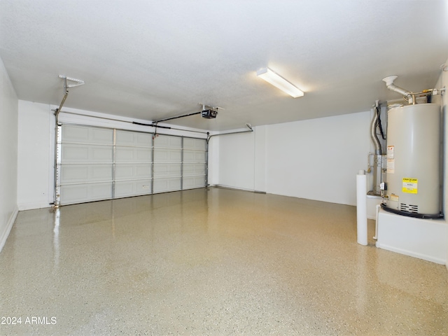 garage with water heater and a garage door opener