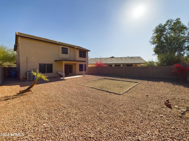 back of house with central AC unit and a patio area