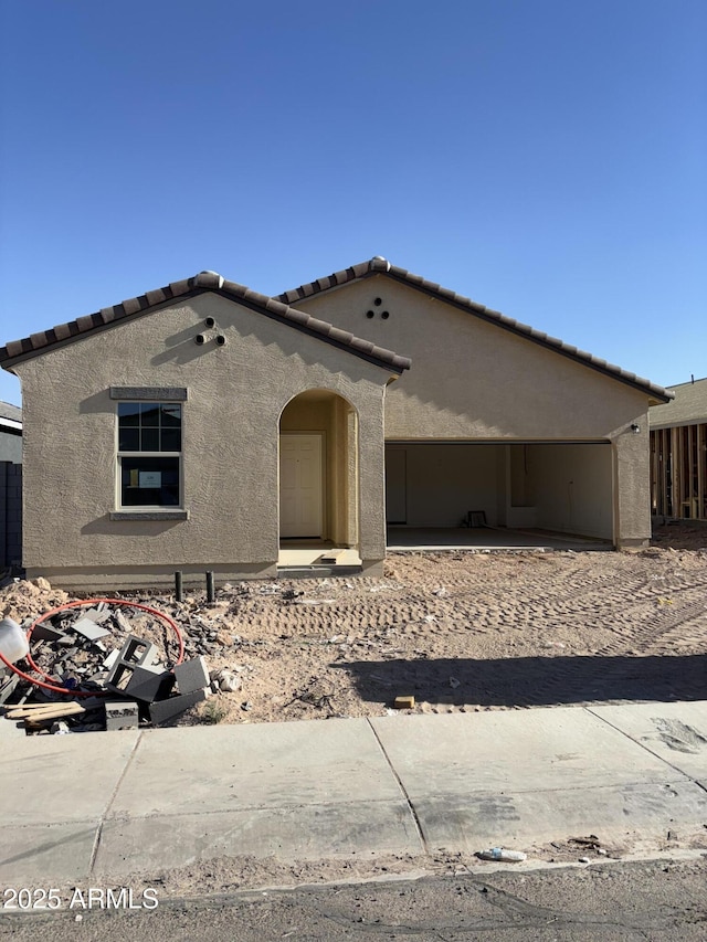 6029 E Artemis Dr, Florence, AZ 85132 - view of front of property with stucco siding, an attached garage, and a tile roof