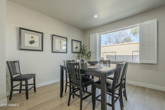 dining room with light wood-type flooring